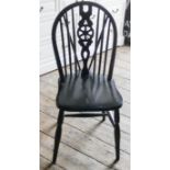 A set of four wheel back Windsor dining chairs