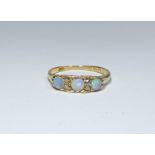 A Victorian opal and diamond ring set in 18ct yellow gold, ring size M, approximate weight 2.