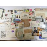 A box containing a large amount of first day covers, postal history,