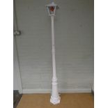 A white painted 6'6 tall 240 volt lightweight metal lamp post