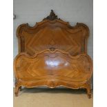 A French 4'6 walnut panelled bedstead