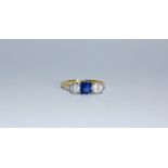 A diamond and sapphire three stone ring,