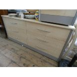 A modern light beech long low chest fitted six drawers with stainless steel handles 5'6 wide