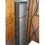 A four drawer metal filing cabinet