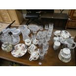 A quantity of assorted wine glasses, fruit bowls, tea ware, biscuit barrel,