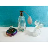 A collection of three scent bottles,