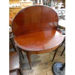 A Victorian mahogany D shaped folding top tea table on square taper legs,