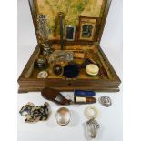 An old cutlery box containing teething rattle, napkin ring, brooches, snuff shoe, picture frames,
