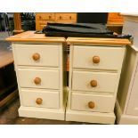 A pair of cream and pine three drawer bedside chests
