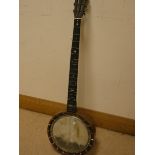 A six string walnut cased banjo
