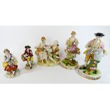 A collection of porcelain figurines to include a pair of hand painted Japanese porcelain figures