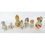 A collection of seven porcelain half dolls