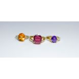 Three modern 9ct gold ladies single stone dress rings - amethyst, citrine and ruby,