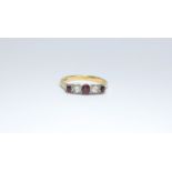 An 18ct gold ruby and diamond five stone ring, ring size T, approximate weight 3.