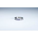 18ct white gold diamond set wedding band, channel set with seven brilliant cut diamonds,