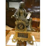 A French striking mantel clock in gilt metal case with bronze scholar figure mount,