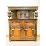 A good quality reproduction carved oak court cupboard with cupboard back,