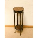 A two tier circular inlaid mahogany plant pedestal