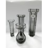 A set of three contemporary Wedgwood art glass vases of candle holders,