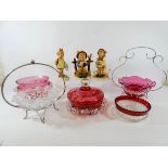 Three Hummel figurines of children and five pieces of cranberry and other glass