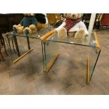 A pair of contemporary square glass coffee tables