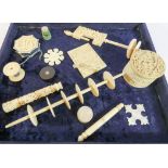 A collection of 19th Century oriental carved ivory and bone sewing collectable's to include sewing