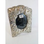 An Edwardian hallmarked silver embossed photograph frame,