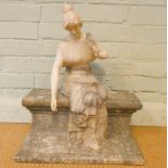 A Victorian marble figure of a lady seated on a wall approximately 21" high X 17.