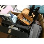 A large box of cameras, camera accessories,