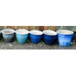 Five circular ceramic garden pots
