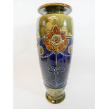 A Royal Doulton Arts and Crafts stoneware vase decorated with stylized sunflowers,