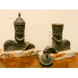A pair of Neo classical design chenets or incense burners standing on stylised rams head bases and