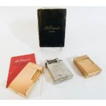A collection of three lighters to include Dupont and Dunhill
