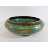 A circular cloisonne bowl, decorated with chrysanthemums on a turquoise ground,