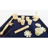 A collection of 19th Century oriental carved ivory and bone sewing collectable's to include sewing
