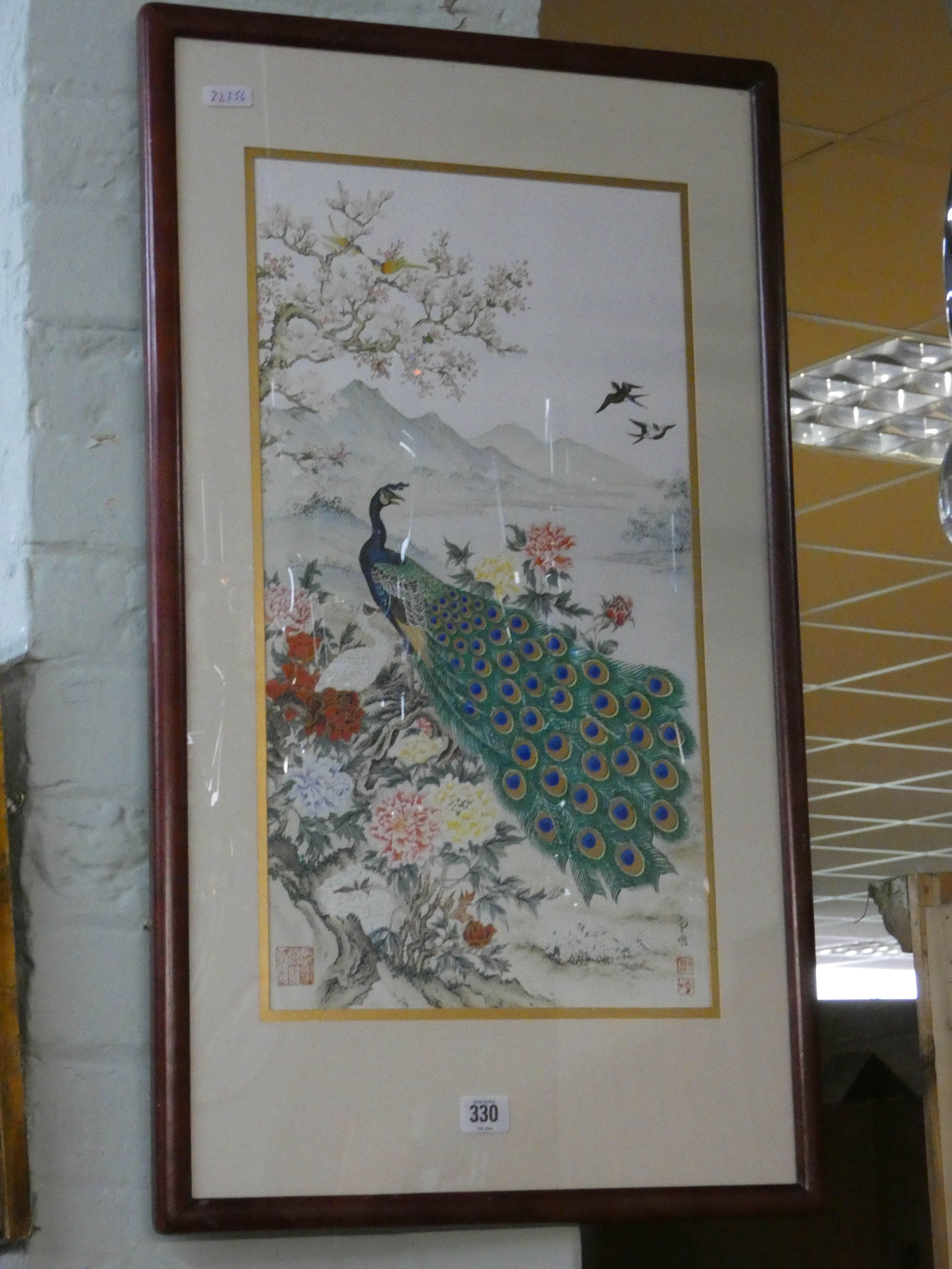 A modern Chinese painting on silk of a peacock