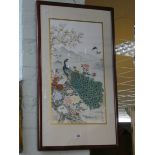 A modern Chinese painting on silk of a peacock