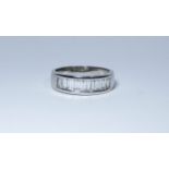 An 18ct white gold diamond half-eternity ring,