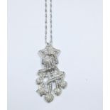 An 18ct white gold and cubic zirconia shooting star pendant on an 18ct white gold fine chain,