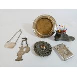 A collection of small silverware to include a silver circular photograph frame, vesta case,