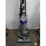 A mauve and silver Dyson ball upright vacuum cleaner