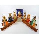 A Royal Doulton Bunnykins Henry VIII and his six wives collection with display stand and all boxes