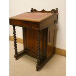 A Victorian walnut Davenport on barley twist legs, fitted cupboard and four interior drawers,