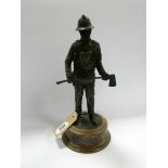A bronze effect fireman ornament