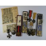 A collection of 2nd World War Nazi regalia to include the iron cross, 1st and 2nd World War,