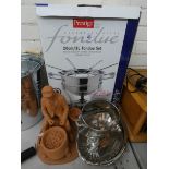 A new Fondue set, a clay figure of a chestnut seller,