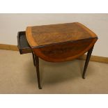 A Sheraton style oval mahogany Pembroke table fitted drawer with wide satin wood cross banded top,