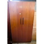 A 1970's Gplan teak semifitted two door wardrobe