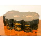A Chinese lacquered and gilt decorated shaped box with interior box fittings