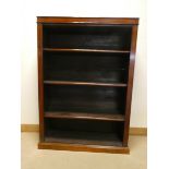 A mahogany open bookcase fitted three adjustable shelves, 42" wide,